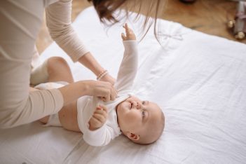 Mother Dressing Baby for Bed