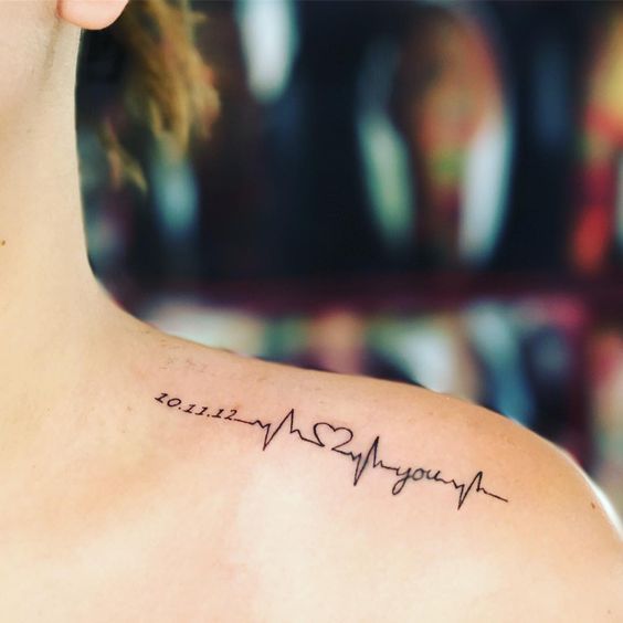 Mom dad & heartbeat tattoo on side hand | Instagram